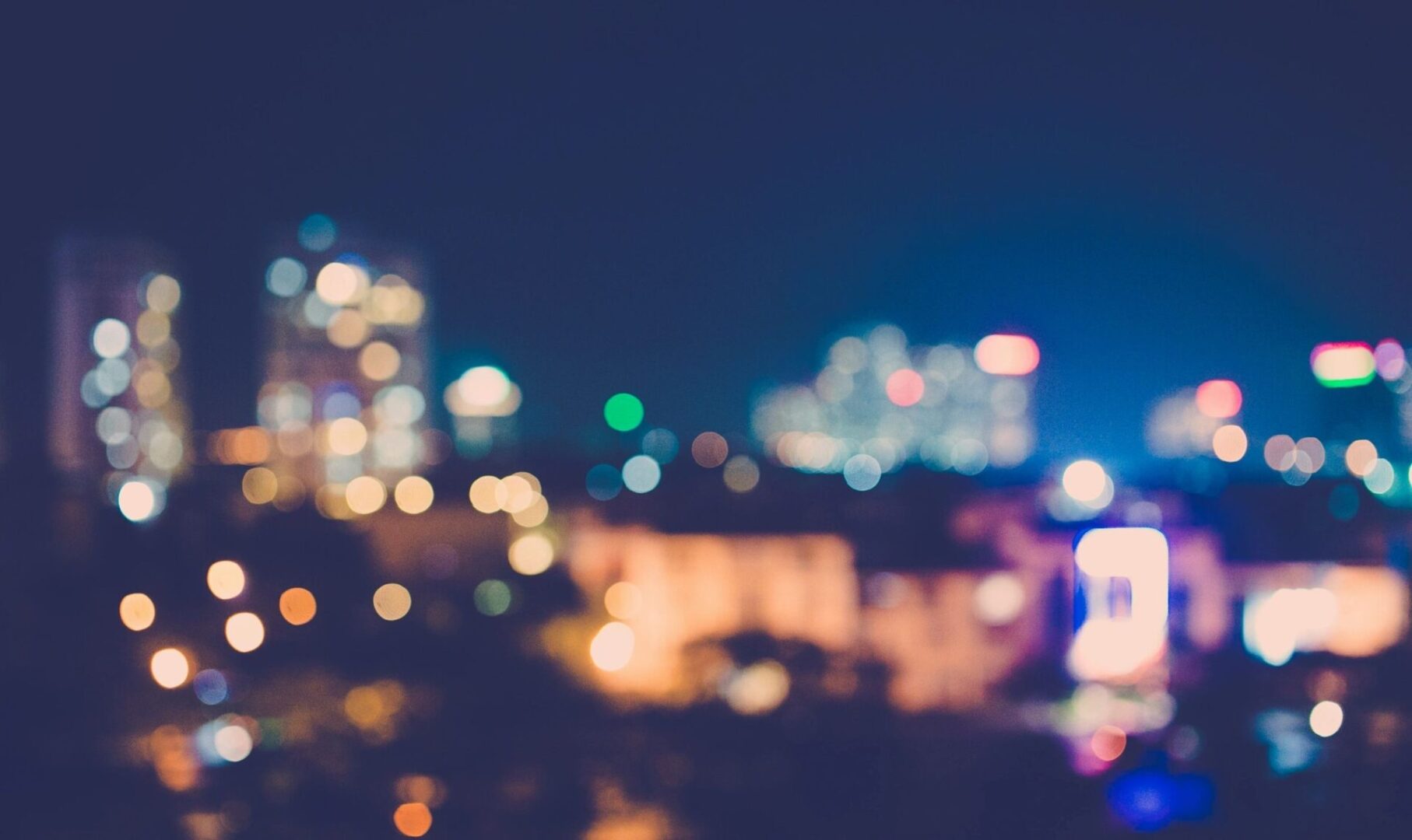 Blurred city lights creating a colorful nightscape.