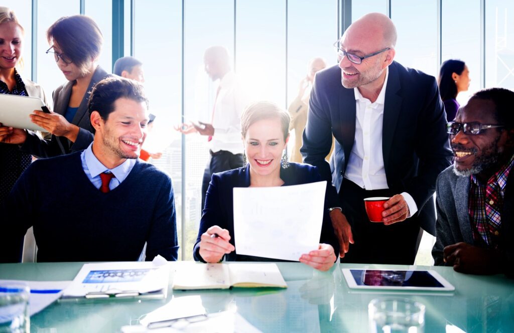 Business team reviewing documents in a modern office setting.