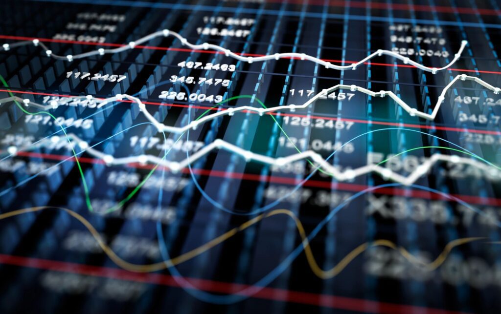 Close-up of financial charts with fluctuating stock data and trend lines.