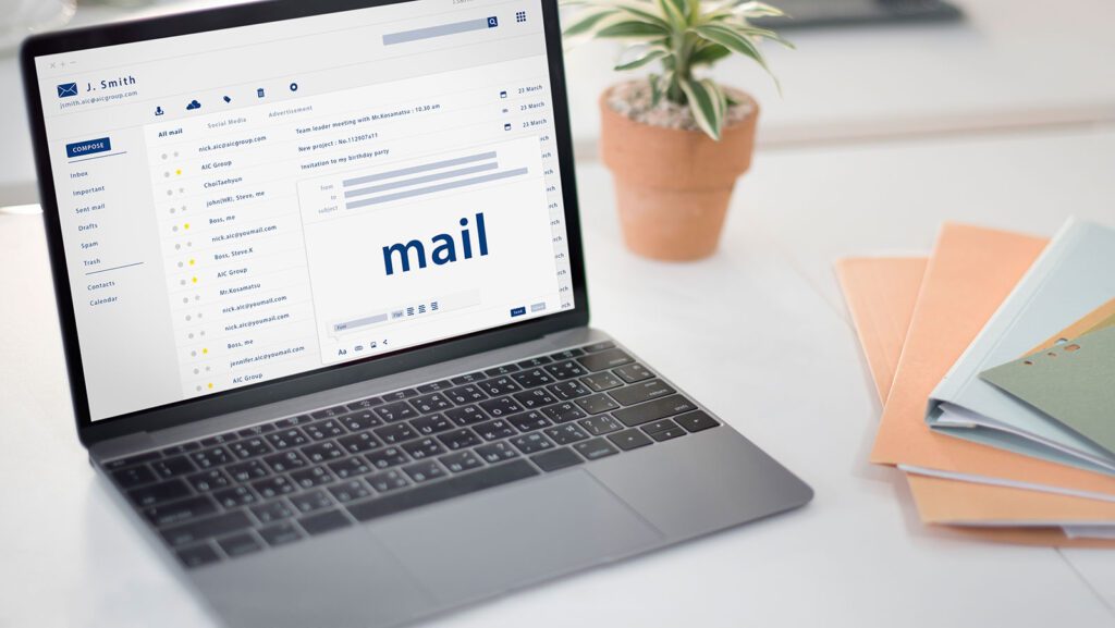 Laptop screen displaying an email inbox with 'mail' highlighted.