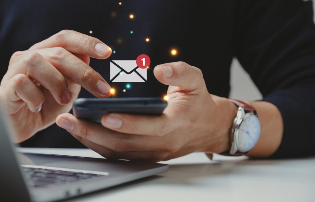 Person checking email notifications on smartphone.