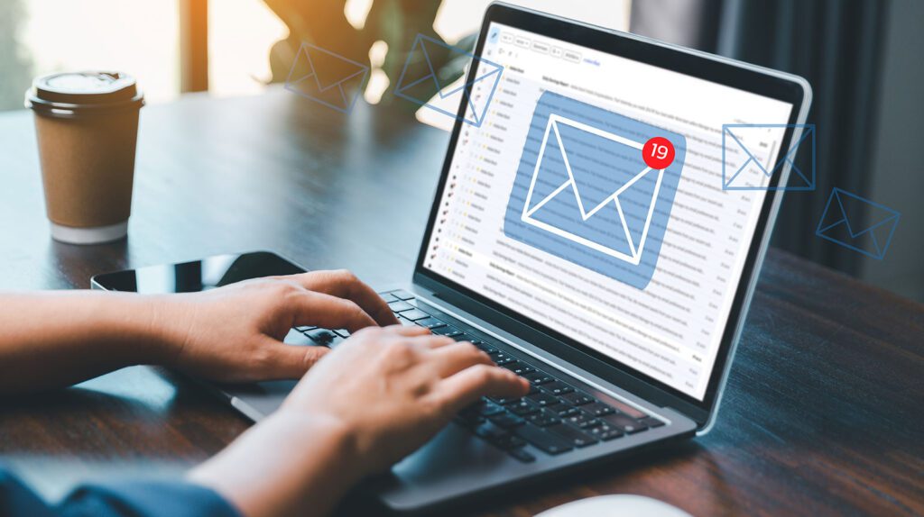 Person checking email notifications on a laptop.