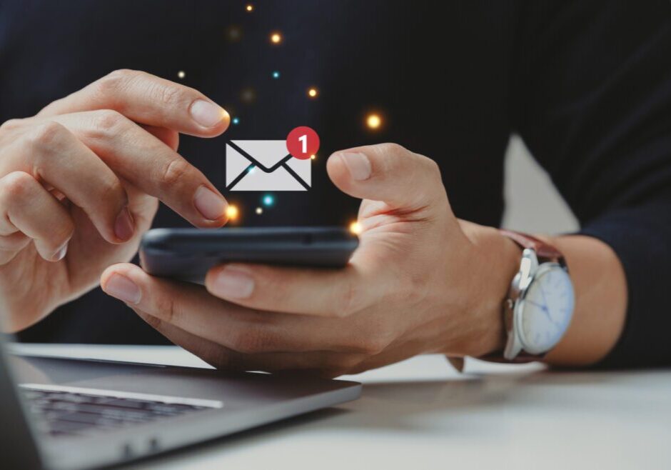 Person checking email notifications on smartphone.