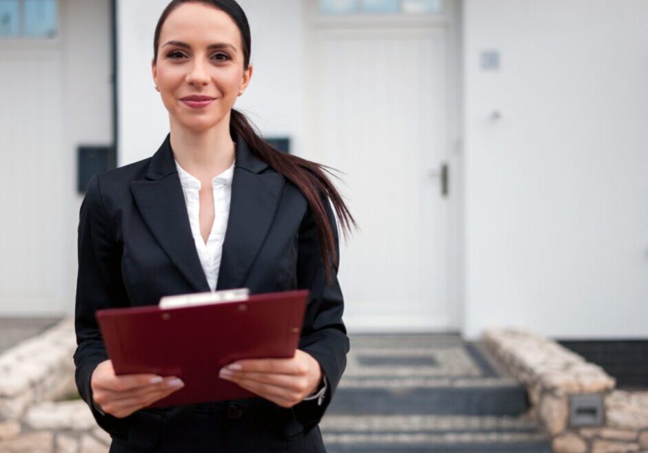 Confident female professional holding a clipboard outdoors.