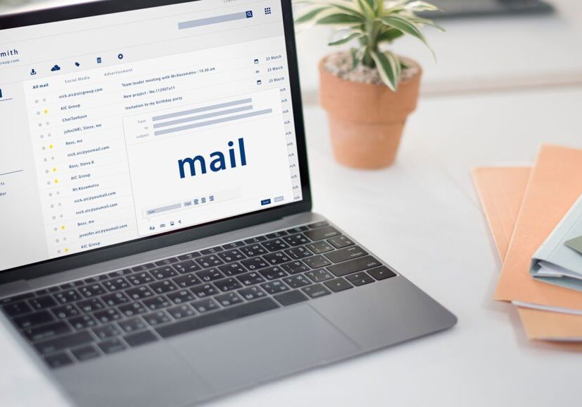 Laptop screen displaying an email inbox with 'mail' highlighted.