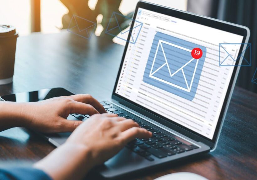 Person checking email notifications on a laptop.