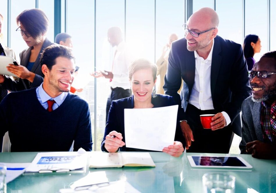 Business team reviewing documents in a modern office setting.