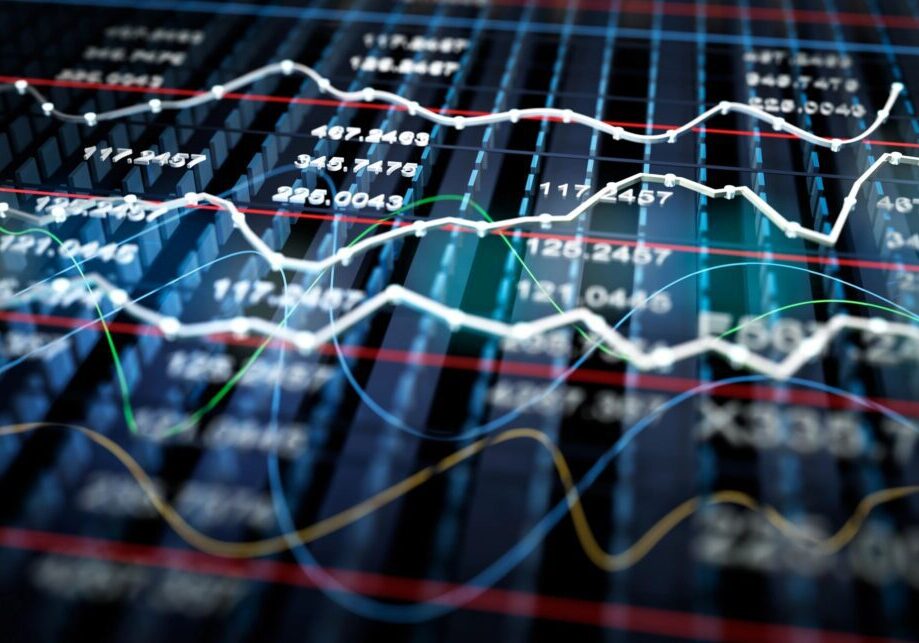 Close-up of financial charts with fluctuating stock data and trend lines.