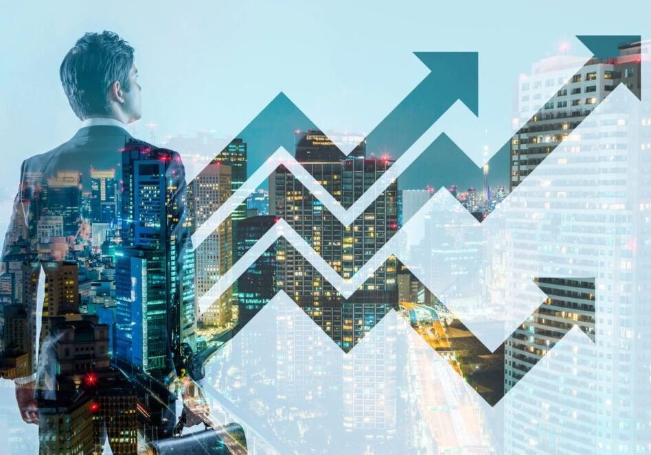Double exposure of a businessman and upward financial graph over cityscape.