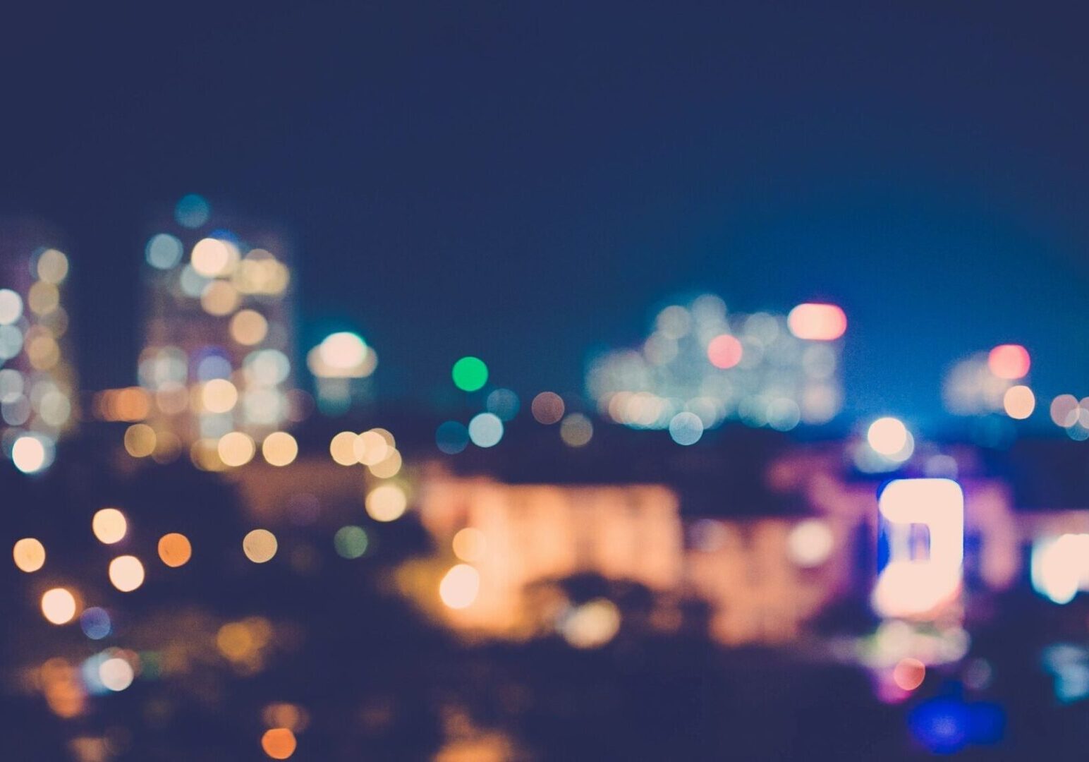Blurred city lights creating a colorful nightscape.